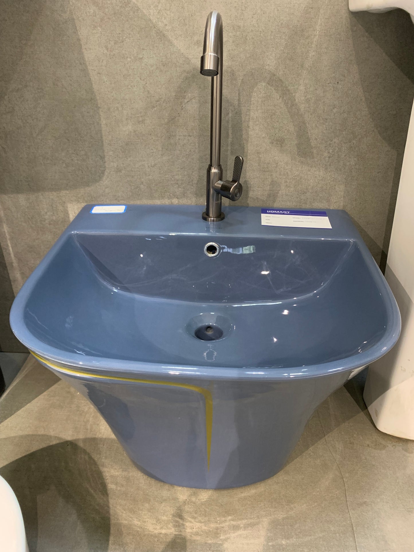 Blue with gold line wall hung basin