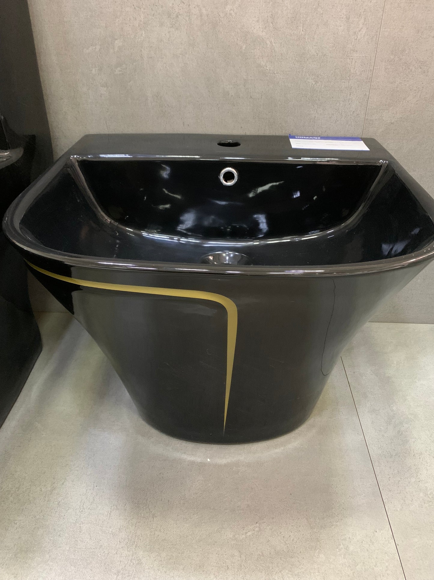 Black with gold line wall hung basin